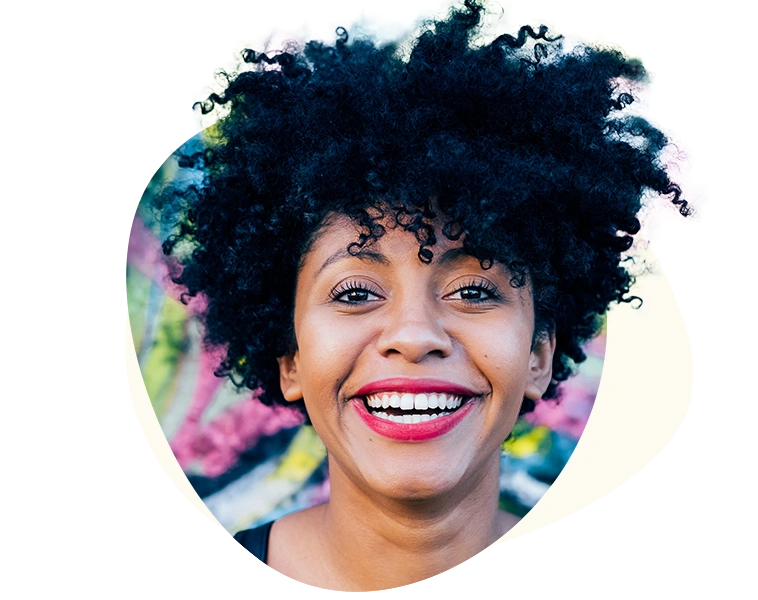 A confident woman smiling as part of her New Year's resolution for better mental health and personalized therapy with Turnwell.