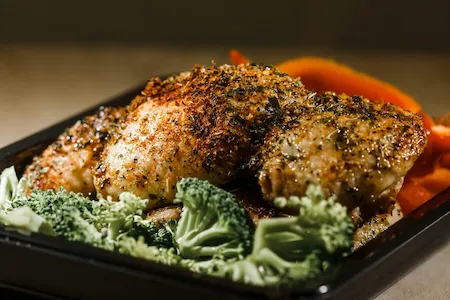 Lemon herb baked chicken thighs with roasted vegetables, a brain-healthy September recipe from STMHA